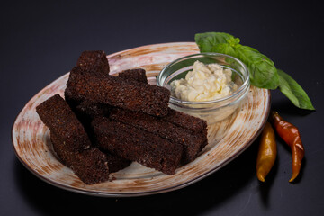 Black crouton with garlic sauce