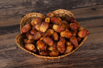 Sweet tasty dry dates in the basket
