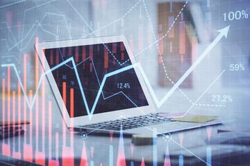 Forex Chart hologram on table with computer background. Multi exposure. Concept of financial markets.