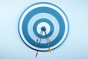 Arrows from a bow in blue target.