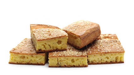 Cornbread slices with sesame seeds, traditional breakfast pastry isolated on white background