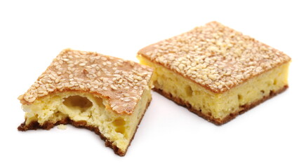 Cornbread slices with sesame seeds, traditional breakfast pastry isolated on white background