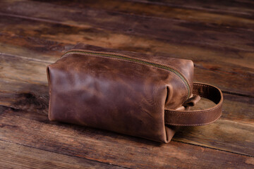 Beautiful small women's leather bag on a wooden background
