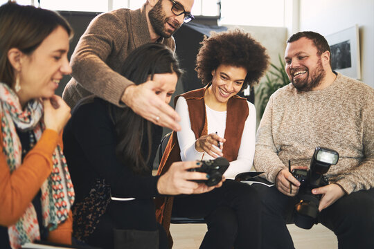 Educator showing attendees how camera works. Photography class concept.