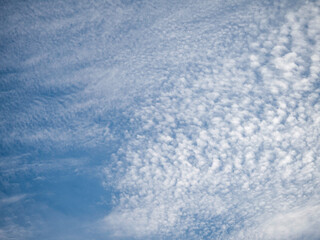 Fototapeta na wymiar Cirrus-Cumulus clouds in a blue sky.