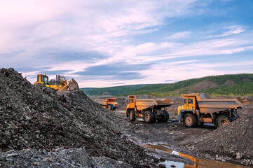  Earthwork, transportation of mountain soil by mining dump trucks © Letopisec