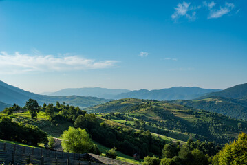 panorama of green mountains and blue sky. Countryside.