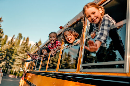 Children in school bus - Powered by Adobe