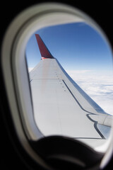Passenger air transportation. View of the clouds from the window of the plane.