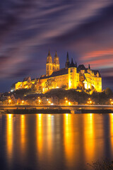 Fototapeta na wymiar Dramatic view on Albrechtsburg castle and cathedral on the River Elbe during night.