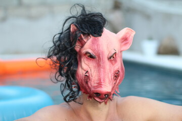 Scary looking man in swimming pool 
