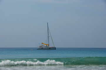 Fototapeta premium yacht in the ocean. white clean sand and yacht in clear sea water