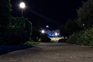 ground view empty city park at night