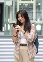 Woman looking at her cellphone on her hands