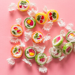 Lollipops on a pink background. Square banner