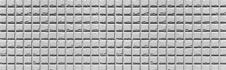Panorama of White stone block wall seamless background and pattern texture