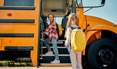 Children near school bus