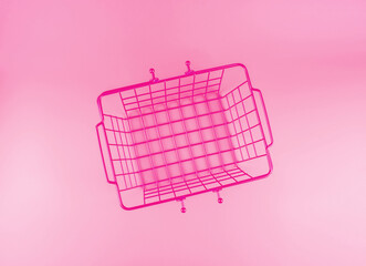 Female fashion shopping concept illustration with an empty shopping basket on pink background