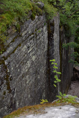 Geometrically regular shapes of layered sandstone rocks in the Chertovo Gorodishche tract (devil's settlement, stone city). Taiga forest in the foothills of the Western Urals.