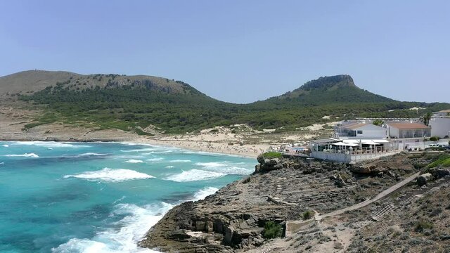 Aerial view, flight at cliff and beach with Hotel, Cala Agulla, Cala Mesquida, Mallorca, Balearic Islands, Spain