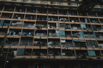 Old apartment building (before 1975) , balconies on a decaying and overcrowded apartment building in Saigon, Vietnam
