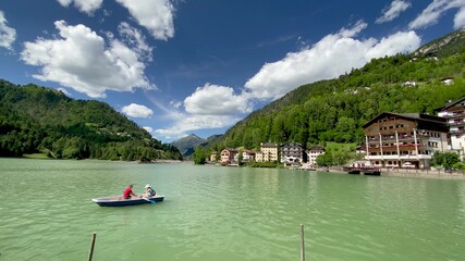 ALLEGHE, ITALY - AUGUST 2020: Boat on the beautiful lake in summer season