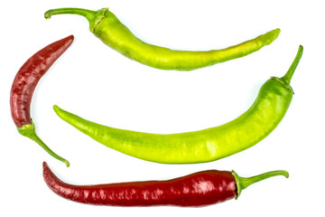 Hot peppers of red and green color isolated on white background.
