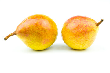 Two pears of yellow-pink color isolated on a white background.