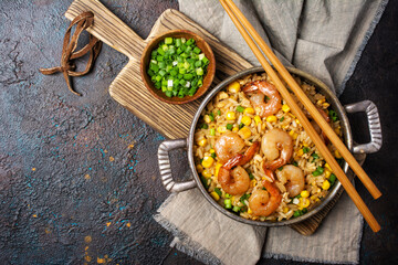 A traditional dish of Asian cuisine. Rice with shrimps, green onion and yellow corn
