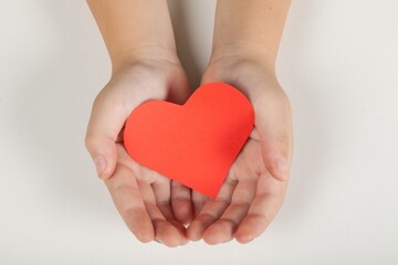 Hands Holding a Paper Heart