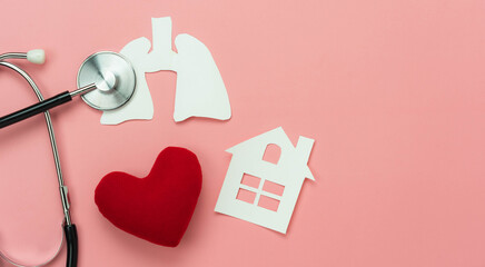Table top view aerial image of accessories healthcare & medical of National Organ Donor Day with Valentines day background concept.Stethoscope with lung red heart and home on pink paper.copy space