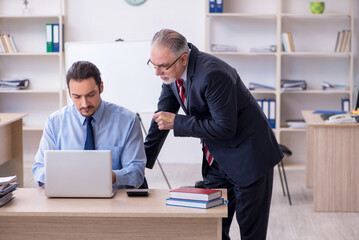 Obraz premium Two employees in the office