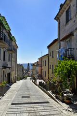 A narrow street among the old houses of Santa Croce del Sannio, a medieval village in the Campania region.
