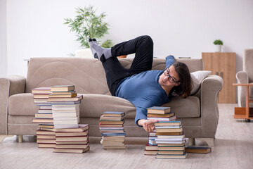 Young male student preparing for exams at home