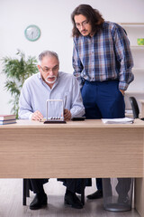 Two employees and meditation balls in the office
