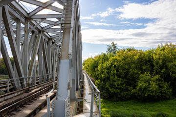 Railway track on a steel bridge structure in the countryside