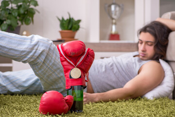 Male ex-champion boxer suffering from alcoholism at home