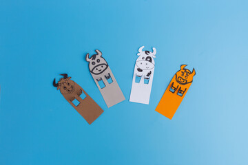 Bookmarks with bull or cow on blue background, handmade paper craft for kids