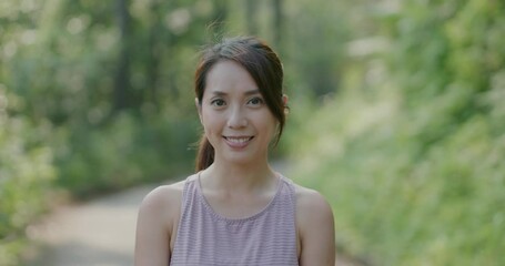 Woman smile to camera at park