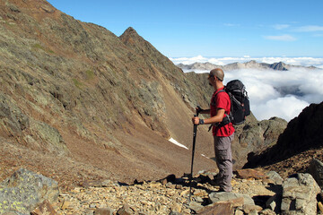 Young man near Montcalm peak, Pyrenees, France, 3077 meters.
