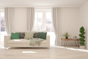 White living room with sofa and winter landscape in window. Scandinavian interior design. 3D illustration