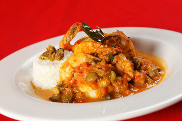 Shrimp with caper, chaya leaf and steamed rice.