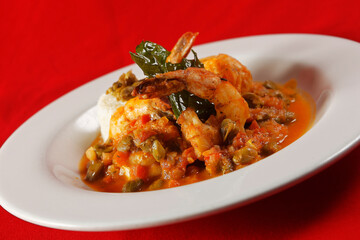 Shrimp with caper, chaya leaf and steamed rice.