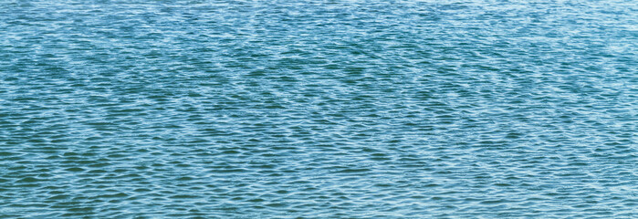 Blue ocean panorama with sun reflection, The vast open sea with clear sky, Ripple wave and calm sea with beautiful sunlight