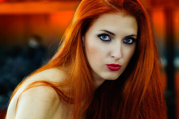 Plakat beautiful red-haired girl in the garage