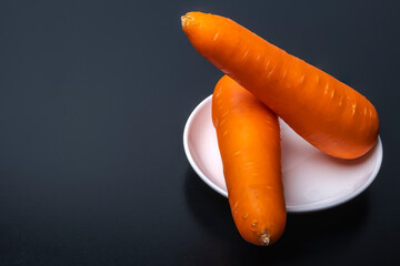 Fresh Carrot on Black Background