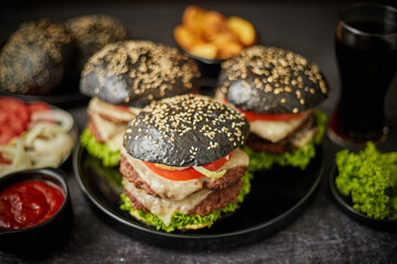 Delicious black hamburger with patties and cheese