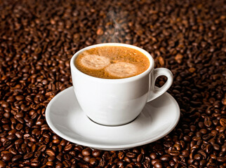 Cup with coffee on the background of coffee beans