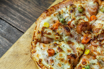 pizza on wood table close up image  for food content.