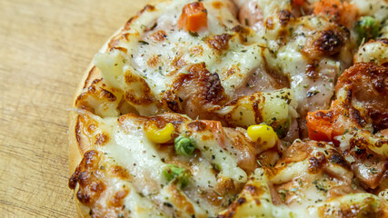 pizza on wood table close up image  for food content.